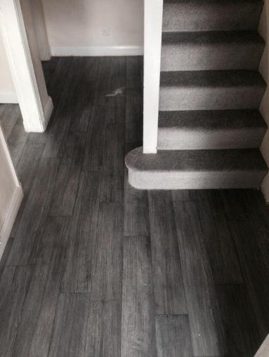 Black wood vinyl hallway and stain free twist carpet on stairs